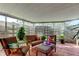 Covered patio with seating, plants, and privacy screen providing a relaxing outdoor space at 2600 Forest Run Ct, Clearwater, FL 33761