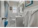 Bright bathroom with white tile, modern fixtures, and ample natural light at 2613 Upton S St, Gulfport, FL 33711