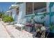Charming blue house with a bench, colorful plants, and a well-maintained exterior at 2613 Upton S St, Gulfport, FL 33711
