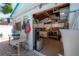 Outdoor patio area connected to garage with seating and decor, with unique bar counter with stools at 2613 Upton S St, Gulfport, FL 33711