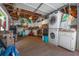 Functional garage space with washer and dryer, ample storage, and a well-organized layout at 2613 Upton S St, Gulfport, FL 33711