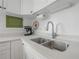 A close-up shot of the kitchen sink and counter area, highlighting the modern faucet and countertops at 2613 Upton S St, Gulfport, FL 33711