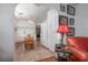 Charming kitchen featuring white cabinetry, rustic wood floors, and unique, eclectic decor elements at 2613 Upton S St, Gulfport, FL 33711