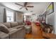 Spacious living room featuring hardwood floors, comfortable seating, and ample natural light, creating a warm ambiance at 2613 Upton S St, Gulfport, FL 33711