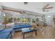 Bright sunroom with tile floors and ample seating, perfect for relaxation and enjoying the natural light at 2613 Upton S St, Gulfport, FL 33711