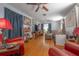 Open living room with hardwood floors, ceiling fans and comfortable seating arrangement, perfect for relaxation and entertaining at 2613 Upton S St, Gulfport, FL 33711