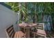 An outdoor seating area is surrounded with tall bamboo at 2613 Upton S St, Gulfport, FL 33711
