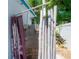 Unique outdoor shower features a bamboo surround, privacy curtain, and tropical landscaping at 2613 Upton S St, Gulfport, FL 33711
