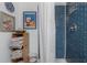 Modern bathroom with blue subway tile shower and white shower curtain at 2613 Upton S St, Gulfport, FL 33711