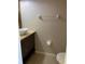 Cozy half bathroom featuring a unique vanity with vessel sink at 2950 Willowleaf Ln, Wesley Chapel, FL 33544