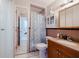 Bathroom featuring a vanity, toilet, and shower with modern fixtures and tile flooring at 3213 W Ivy St, Tampa, FL 33607