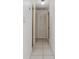 Hallway featuring tile floors and linen closet at 3213 W Ivy St, Tampa, FL 33607