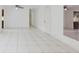 Open floor plan featuring ceramic tile flooring and a neutral color palette at 3213 W Ivy St, Tampa, FL 33607