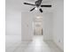 Bright living area with tile flooring, ceiling fan and view to kitchen at 3213 W Ivy St, Tampa, FL 33607