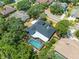 Aerial view of the home with a screened-in pool and mature trees at 3309 Westmoreland Dr, Tampa, FL 33618