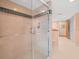 Well-lit shower with custom tile and glass door at 3309 Westmoreland Dr, Tampa, FL 33618