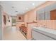 Bright bathroom featuring modern sink, open shower access, and walkout access to pool at 3309 Westmoreland Dr, Tampa, FL 33618