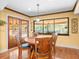 Cozy dining area with a round table and chairs, adjacent to the kitchen at 3309 Westmoreland Dr, Tampa, FL 33618