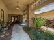 Inviting front entrance featuring a covered porch, brickwork, well-maintained landscaping, and double doors at 3309 Westmoreland Dr, Tampa, FL 33618