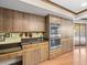 Well-equipped kitchen featuring double ovens and access to the outdoor pool area at 3309 Westmoreland Dr, Tampa, FL 33618