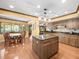 Spacious kitchen featuring an island, stainless steel appliances, and a dining area at 3309 Westmoreland Dr, Tampa, FL 33618