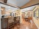 Open concept kitchen with breakfast bar and dining area with views of the pool at 3309 Westmoreland Dr, Tampa, FL 33618