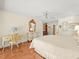 Bright main bedroom featuring ample natural light, ceiling fan, and a cozy sitting area with a desk at 3309 Westmoreland Dr, Tampa, FL 33618