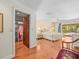 Spacious main bedroom with a walk-in closet, ceiling fan, and sliding door access to the outdoors at 3309 Westmoreland Dr, Tampa, FL 33618
