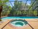 Screened pool and spa area features a sparkling pool, and a relaxing inground hot tub at 3309 Westmoreland Dr, Tampa, FL 33618