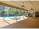 Inviting screened-in pool area with ample seating and outdoor bar area at 3309 Westmoreland Dr, Tampa, FL 33618