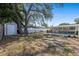 The backyard has a mature shade tree and storage shed, complemented by the covered patio for relaxing at 4232 N Sandalwood Cir, Tampa, FL 33617