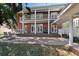 Expansive backyard with brick patio, balcony, and manicured lawn, ideal for outdoor living at 4309 W Robin Ln, Tampa, FL 33609