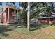 Lush backyard featuring mature trees, brick patio, and a charming garden area for outdoor enjoyment at 4309 W Robin Ln, Tampa, FL 33609