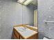 Bathroom with bright floral wallpaper, vanity, and natural light at 4309 W Robin Ln, Tampa, FL 33609