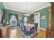 Traditional dining room with wood floors, large windows, and elegant decor at 4309 W Robin Ln, Tampa, FL 33609