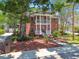 Classic two-story brick home with grand columns and a manicured front yard, exuding timeless elegance at 4309 W Robin Ln, Tampa, FL 33609