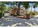 Side view showcasing the home's architectural design and expansive driveway at 4309 W Robin Ln, Tampa, FL 33609
