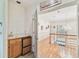 Upstairs hallway with hardwood floors, chandelier and butler pantry off to the side at 4309 W Robin Ln, Tampa, FL 33609