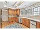 Well-lit kitchen showcasing wood cabinets, stainless appliances, and a bright, airy feel at 4309 W Robin Ln, Tampa, FL 33609