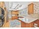 Spacious kitchen with white countertops, wood cabinets, and stainless steel appliances at 4309 W Robin Ln, Tampa, FL 33609