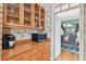 View of kitchen cabinetry, wooden countertop and stainless appliances at 4309 W Robin Ln, Tampa, FL 33609