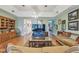 Spacious living room with hardwood floors, tray ceilings, and comfortable seating at 4309 W Robin Ln, Tampa, FL 33609
