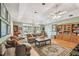 Open living room with hardwood floors, ample seating, and backyard access at 4309 W Robin Ln, Tampa, FL 33609
