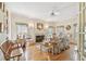 Cozy living room with a fireplace, large windows, and comfortable seating at 4309 W Robin Ln, Tampa, FL 33609