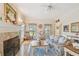 Comfortable living room showcasing fireplace, hardwood floors, and natural light at 4309 W Robin Ln, Tampa, FL 33609