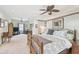Spacious main bedroom with sitting area, fan, and access to a balcony at 4309 W Robin Ln, Tampa, FL 33609
