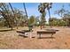Park benches offer a peaceful spot amidst natural landscaping, enhancing community appeal and providing serene relaxation at 4309 W Robin Ln, Tampa, FL 33609