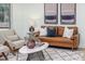 Bright living room featuring a leather sofa, modern decor, and plush rug at 4507 Fox Hunt Dr, Tampa, FL 33624