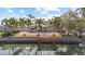 Backyard featuring a private pool, tropical palm trees and waterfront access to the canal at 4531 44Th S St, St Petersburg, FL 33711