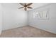 Bedroom with neutral carpet, ceiling fan, and a window with lots of natural light at 4531 44Th S St, St Petersburg, FL 33711